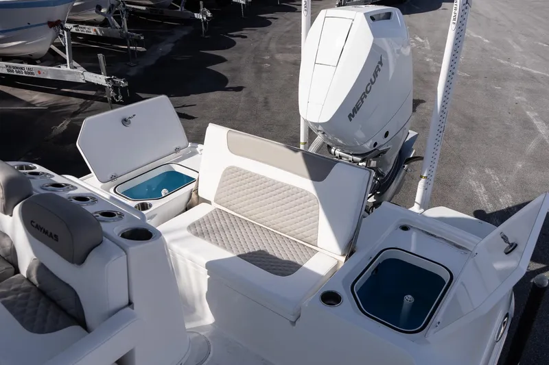 Slide: The Image of 2026 Caymas 26 HB boat with Mercury engine, featuring seating and storage compartments. - 8