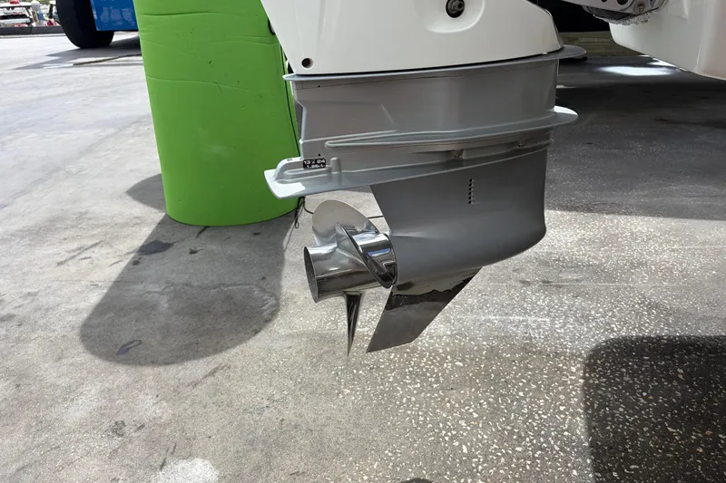 Slide: The Image of Four Winns HD3 boat propeller and outdrive on concrete surface. - 17