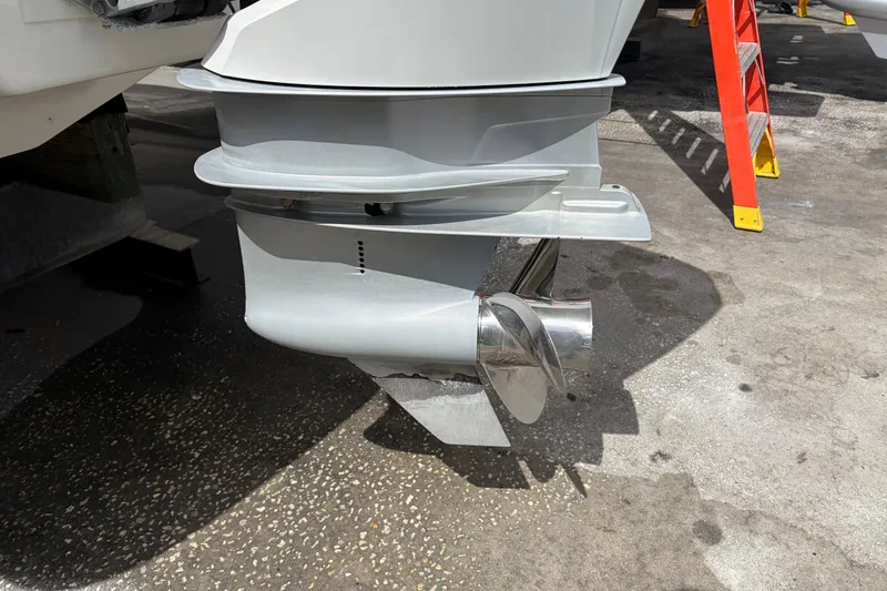 Slide: The Image of Close-up of a Four Winns HD3 boat propeller on a concrete surface. - 18