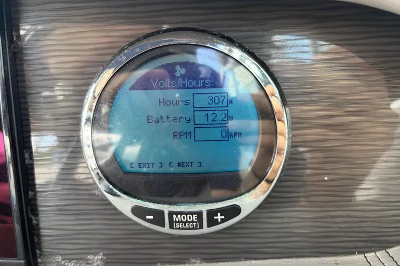 Slide: The Image of Digital display on Four Winns HD3 boat showing hours, battery voltage, and RPM. - 19