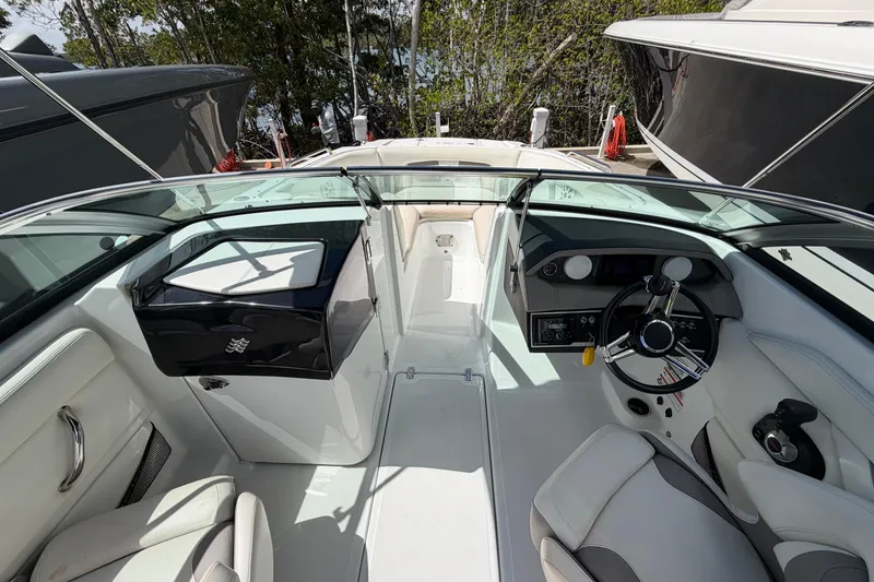 Slide: The Image of Interior view of Four Winns HD3 boat, featuring sleek design and modern controls. - 8