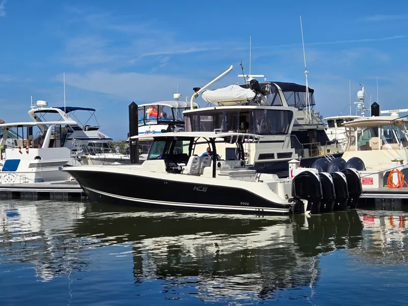Slide: The Image of 2018 HCB 42 Siesta boat docked in marina, sunny day. - 13