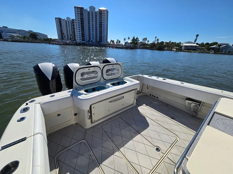 Slide: The Image of HCB 42 Siesta 2018 boat with engines and city view. - 15