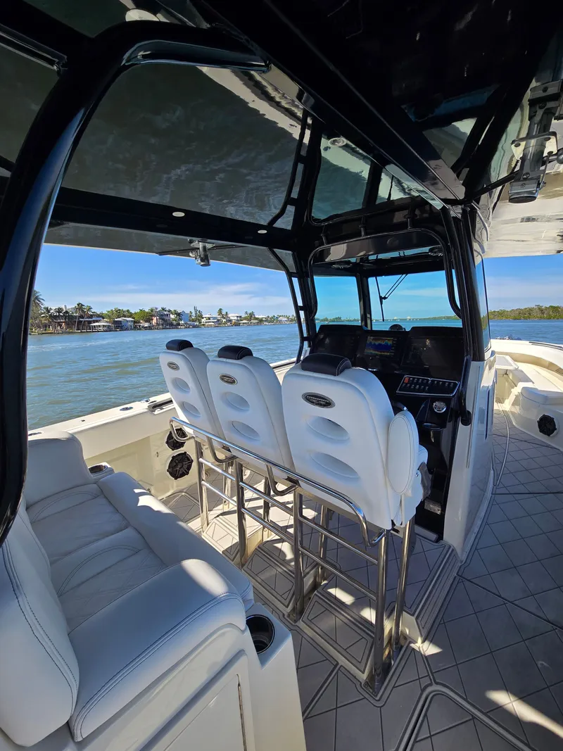 Slide: The Image of Interior view of a 2018 HCB 42 Siesta boat on the water. - 17
