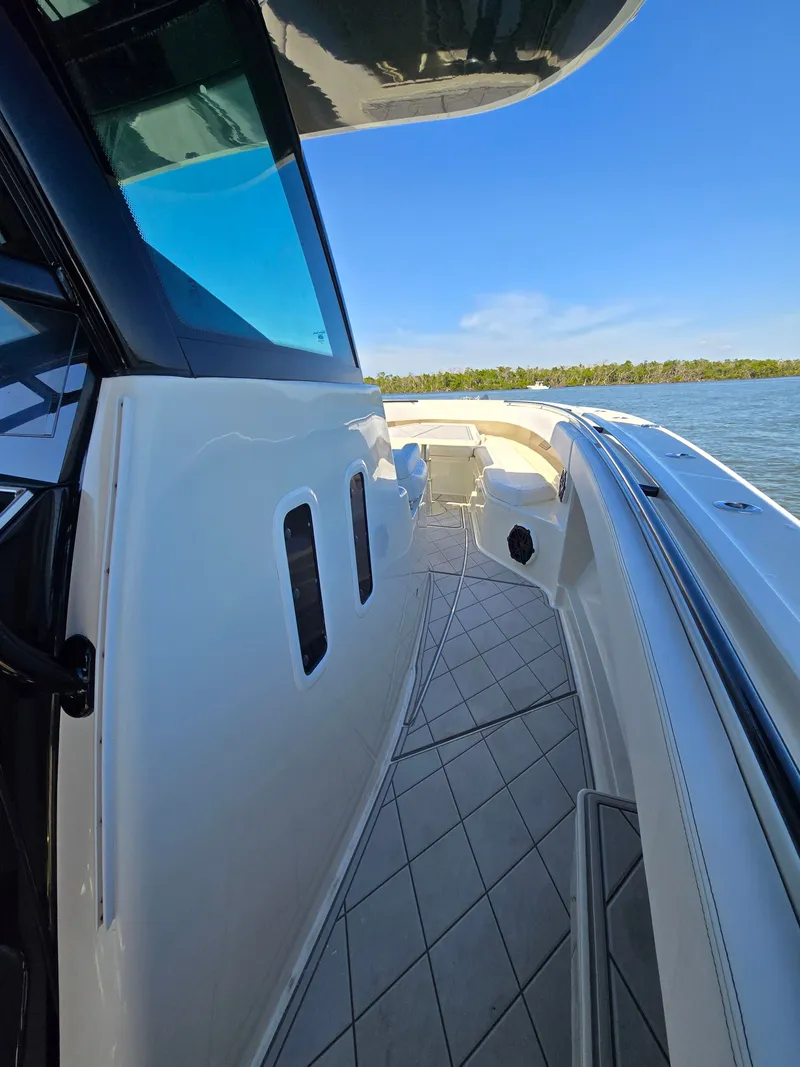 Slide: The Image of HCB 42 Siesta 2018 boat, side view on the water. - 21