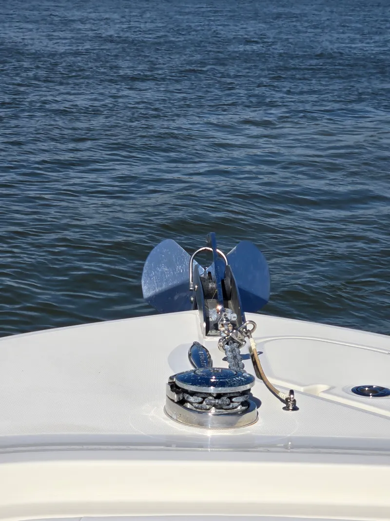 Slide: The Image of Anchor on a 2018 HCB 42 Siesta boat against calm water. - 32