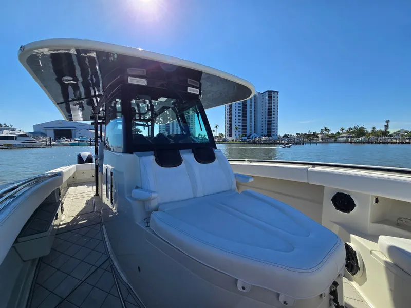 Slide: The Image of 2018 HCB 42 Siesta boat on sunny waters with city view. - 33