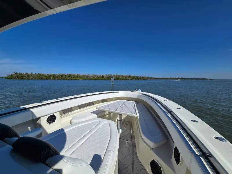 Slide: The Image of HCB 42 Siesta 2018 on calm waters with blue sky. - 35