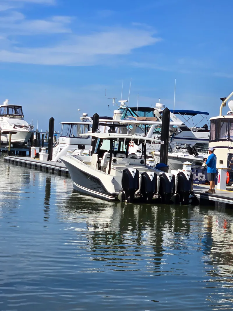 Slide: The Image of 2018 HCB 42 Siesta boat docked at marina. - 36
