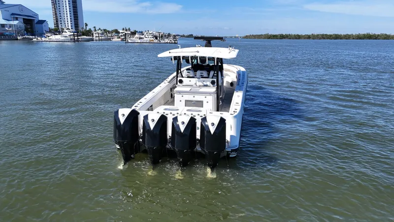 Slide: The Image of HCB 42 Siesta 2018 boat with four outboard engines on the water. - 41