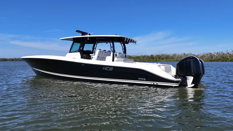 Slide: The Image of 2018 HCB 42 Siesta boat on calm water. - 42