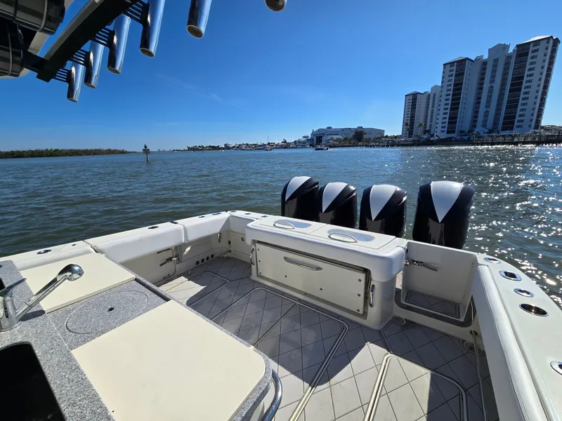 Slide: The Image of 2018 HCB 42 Siesta boat on water with skyscrapers in background. - 7