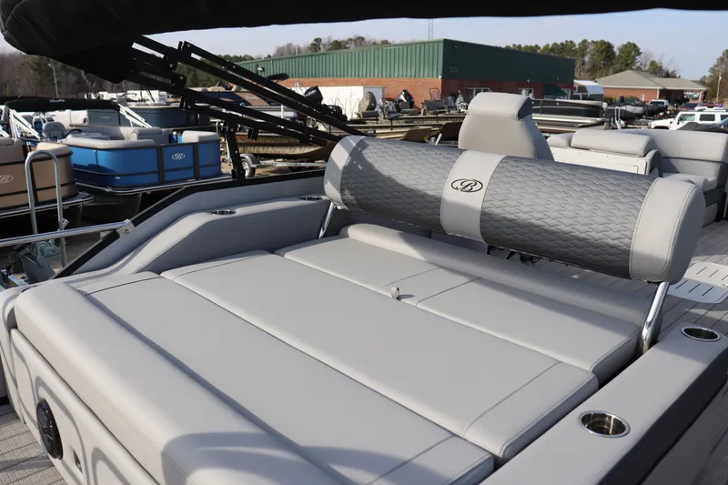 Slide: The Image of 2026 Bentley Pontoons Elite 223 SwingBack DC with luxurious seating and sleek design. - 11