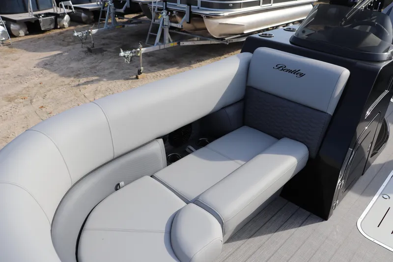 Slide: The Image of 2026 Bentley Pontoons Elite 223 SwingBack DC with luxurious gray seating. - 2