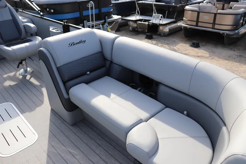 Slide: The Image of 2026 Bentley Pontoons Elite 223 SwingBack DC with luxurious seating and modern design. - 3