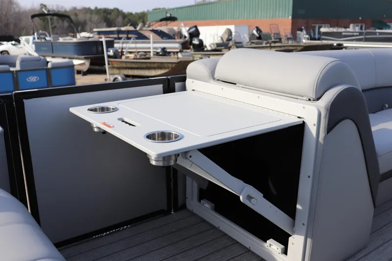 Slide: The Image of 2026 Bentley Pontoons Elite 223 SwingBack DC with foldable table and cup holders. - 7