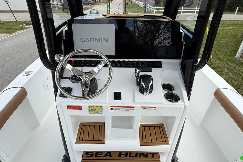 Slide: The Image of 2026 Sea Hunt BX 25 FS boat console with Garmin display and steering wheel. - 11