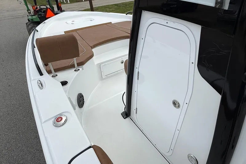 Slide: The Image of 2026 Sea Hunt BX 25 FS boat interior with seating and storage compartment. - 13
