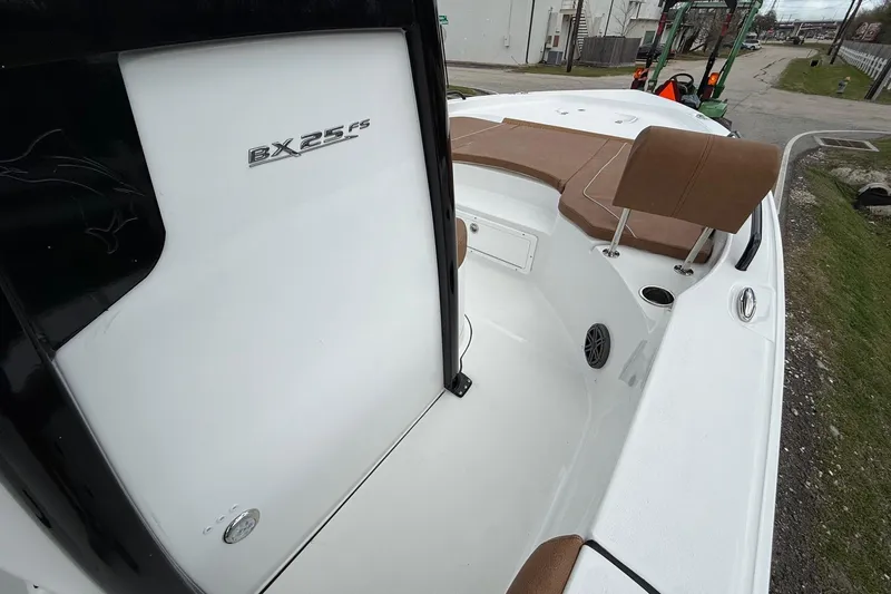 Slide: The Image of 2026 Sea Hunt BX 25 FS boat interior with seating and storage features. - 16