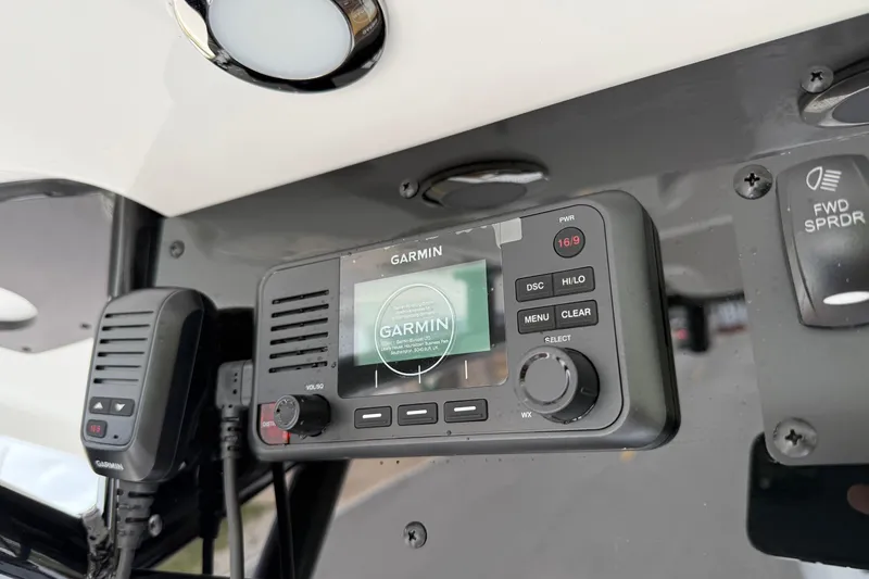 Slide: The Image of Garmin marine radio on 2026 Sea Hunt BX 25 FS boat dashboard. - 21