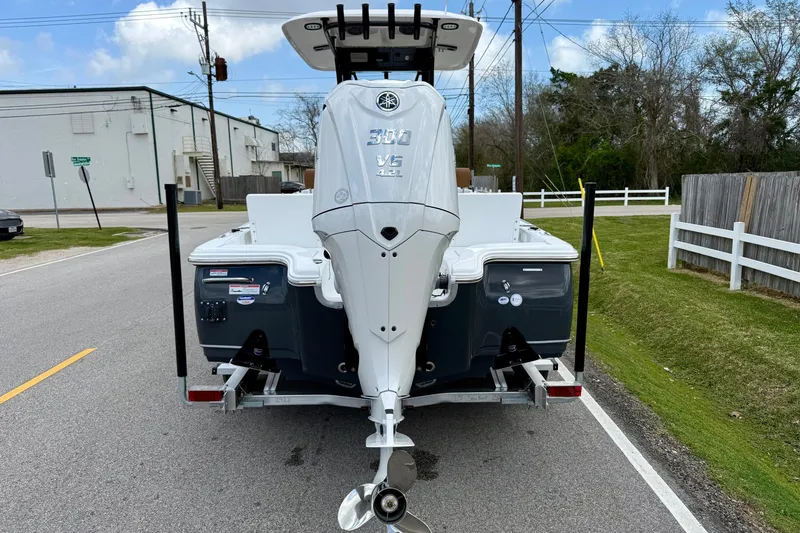 Slide: The Image of 2026 Sea Hunt BX 25 FS boat with powerful outboard motor on trailer. - 3