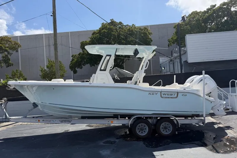 The Image of 2026 Key West 263 FS boat on trailer, parked outdoors. - 1