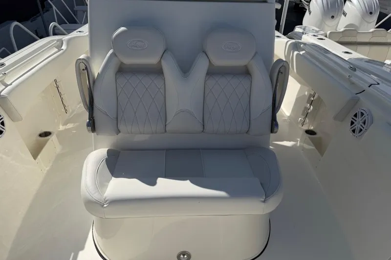 Slide: The Image of 2026 Key West 263 FS boat interior with cushioned seating and modern design. - 14