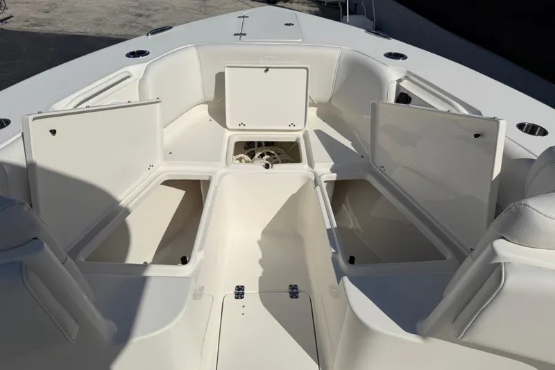Slide: The Image of 2026 Key West 263 FS boat interior with open storage compartments. - 18