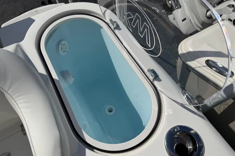 Slide: The Image of 2026 Key West 263 FS boat livewell with open lid and sleek design. - 27