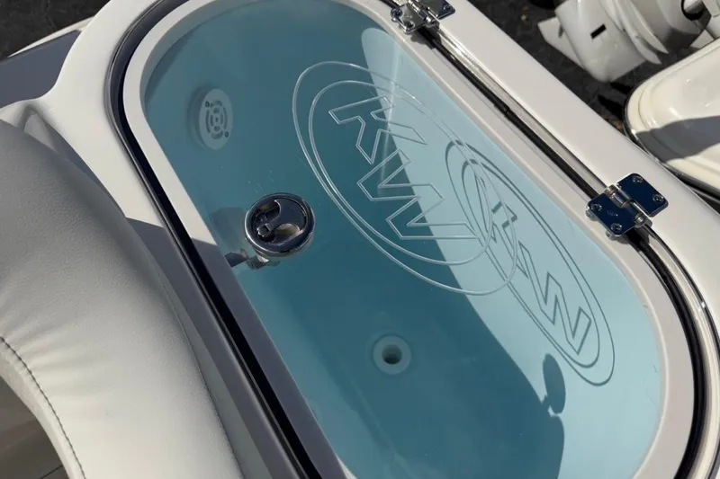 Slide: The Image of 2026 Key West 263 FS boat livewell with KW logo and secure latch. - 28