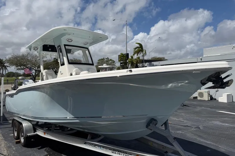 Slide: The Image of 2026 Key West 263 FS boat on trailer under cloudy sky. - 3