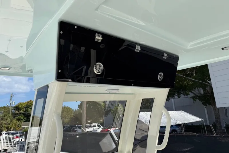 Slide: The Image of 2026 Key West 263 FS boat interior with overhead storage compartment. - 32