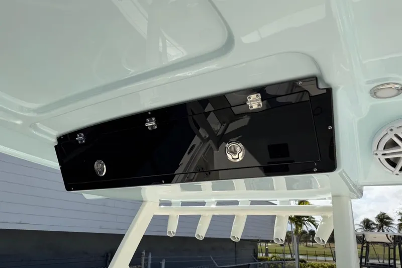 Slide: The Image of 2026 Key West 263 FS boat with overhead storage and speaker system. - 34