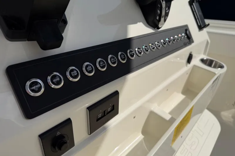 Slide: The Image of Control panel of 2026 Key West 263 FS boat with labeled buttons and switches. - 36