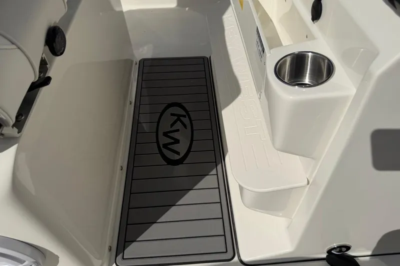 Slide: The Image of 2026 Key West 263 FS boat interior with KW logo and cup holder. - 39