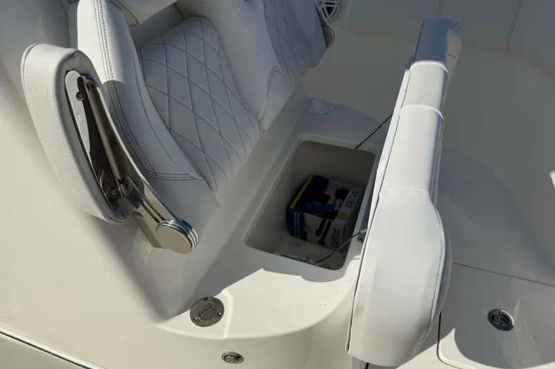 Slide: The Image of 2026 Key West 263 FS boat seat with storage compartment open. - 40