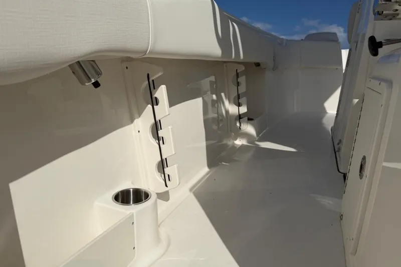 Slide: The Image of 2026 Key West 263 FS boat interior with rod holders and cup holder. - 46