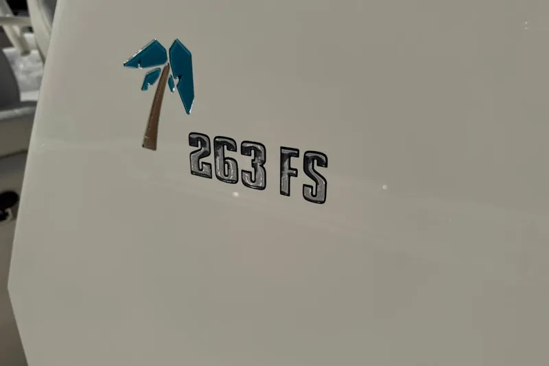 Slide: The Image of 2026 Key West 263 FS boat logo on white surface. - 52