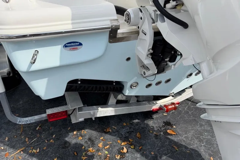 Slide: The Image of 2026 Key West 263 FS boat on trailer, featuring Yamaha engine components. - 6