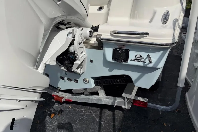 Slide: The Image of 2026 Key West 263 FS boat on trailer, rear view with motor mount. - 7