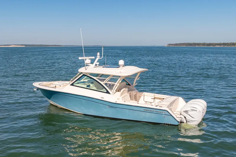 Slide: The Image of 2019 Grady-White Freedom 375 boat on open water, clear sky background. - 1