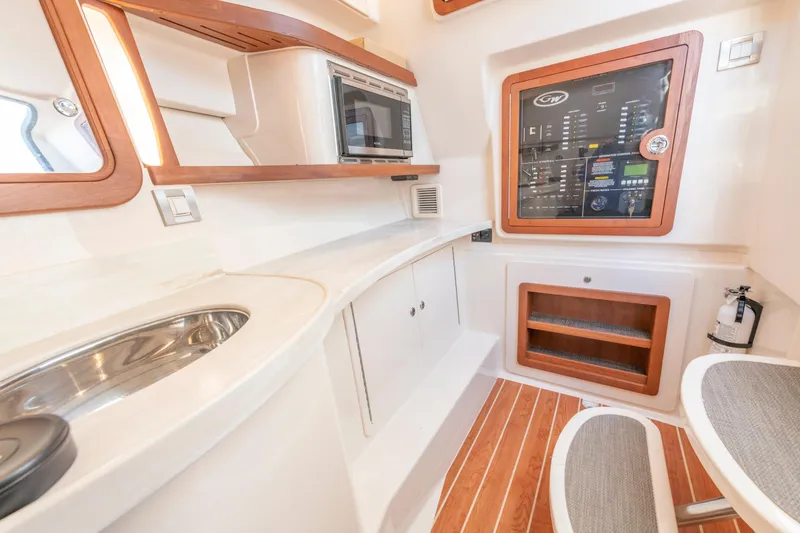 Slide: The Image of Interior of 2019 Grady-White Freedom 375 boat with modern amenities and control panel. - 34