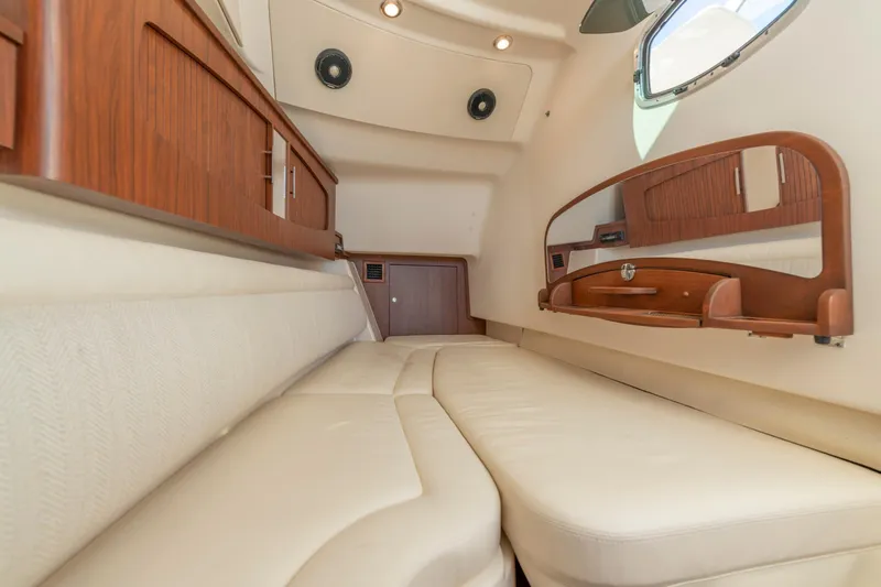 Slide: The Image of Luxurious cabin interior of 2019 Grady-White Freedom 375 boat with wood accents. - 37