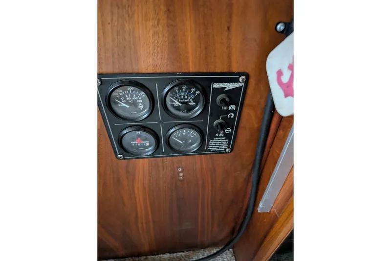 Slide: The Image of Control panel of a 1984 Californian 38 boat with gauges and switches. - 14