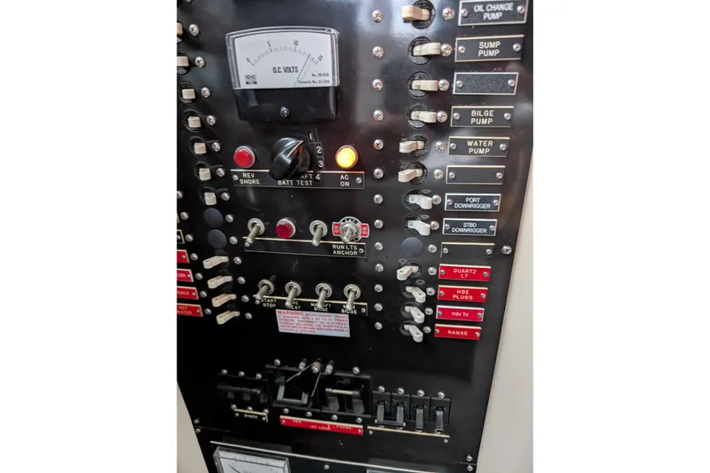 Slide: The Image of Electrical control panel of a 1984 Californian 38 boat with switches and voltmeter. - 15