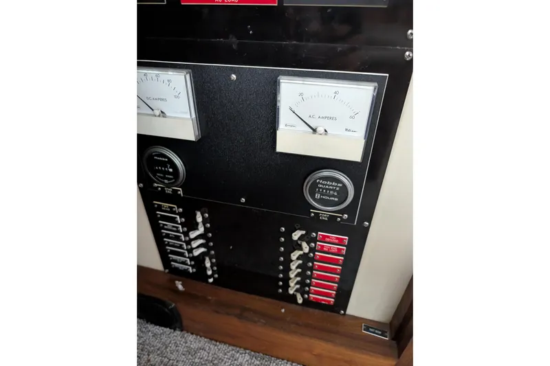 Slide: The Image of Electrical panel with gauges and switches on a 1984 Californian 38 boat. - 16