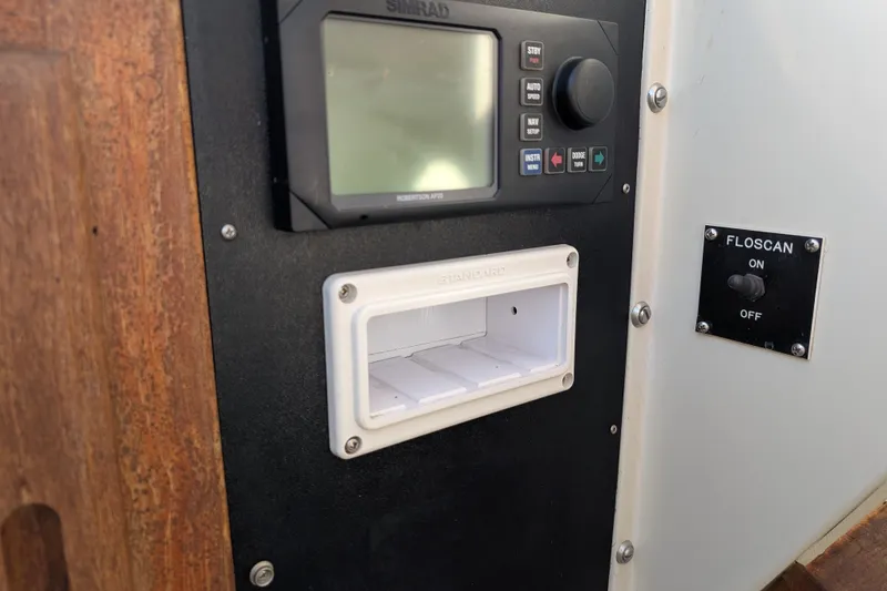 Slide: The Image of Control panel of a 1984 Californian 38 boat with Simrad display and Floscan switch. - 17