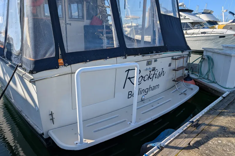 Slide: The Image of 1984 Californian 38 boat named "Rockfish" docked in Bellingham marina. - 2