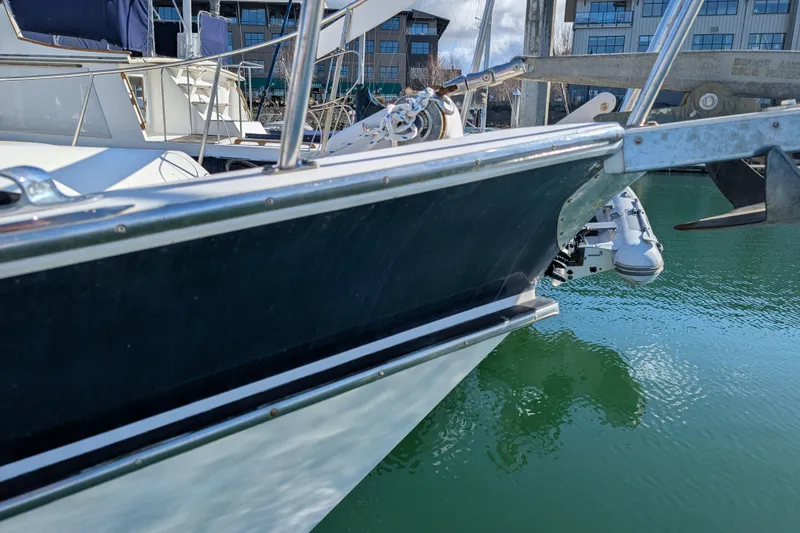 Slide: The Image of 1984 Californian 38 yacht docked in marina, reflecting on calm water. - 24