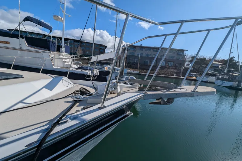 Slide: The Image of 1984 Californian 38 yacht docked in marina, clear sky, calm water. - 25